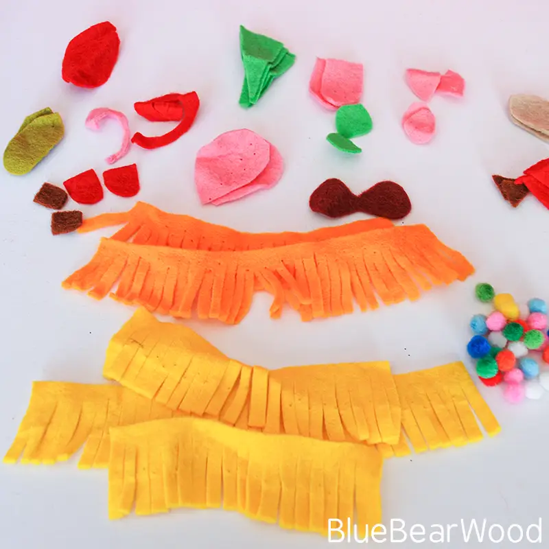 felt pieces and craft materials for making pine cone animals for kids