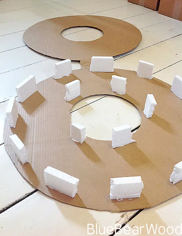 Cardboard rings and polystyrene blocks forming the doughnut shell for a Norman The Slug costume