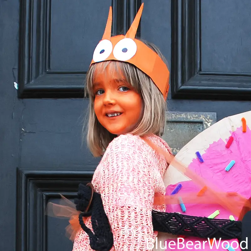 Close up of Norman The Slug costume headband with large paper eyes