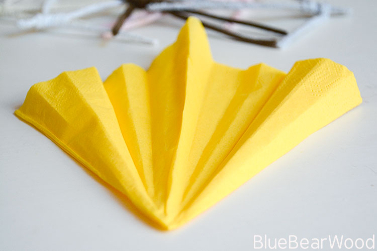 Folding The Napkin 'Concertina Style' to create texture in the dress.