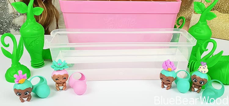 BaBies without Blankets Sitting Next To Lid Filled With Water