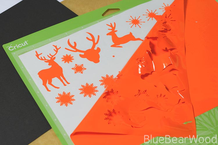 Orange Cricut Window Cling Being Cut